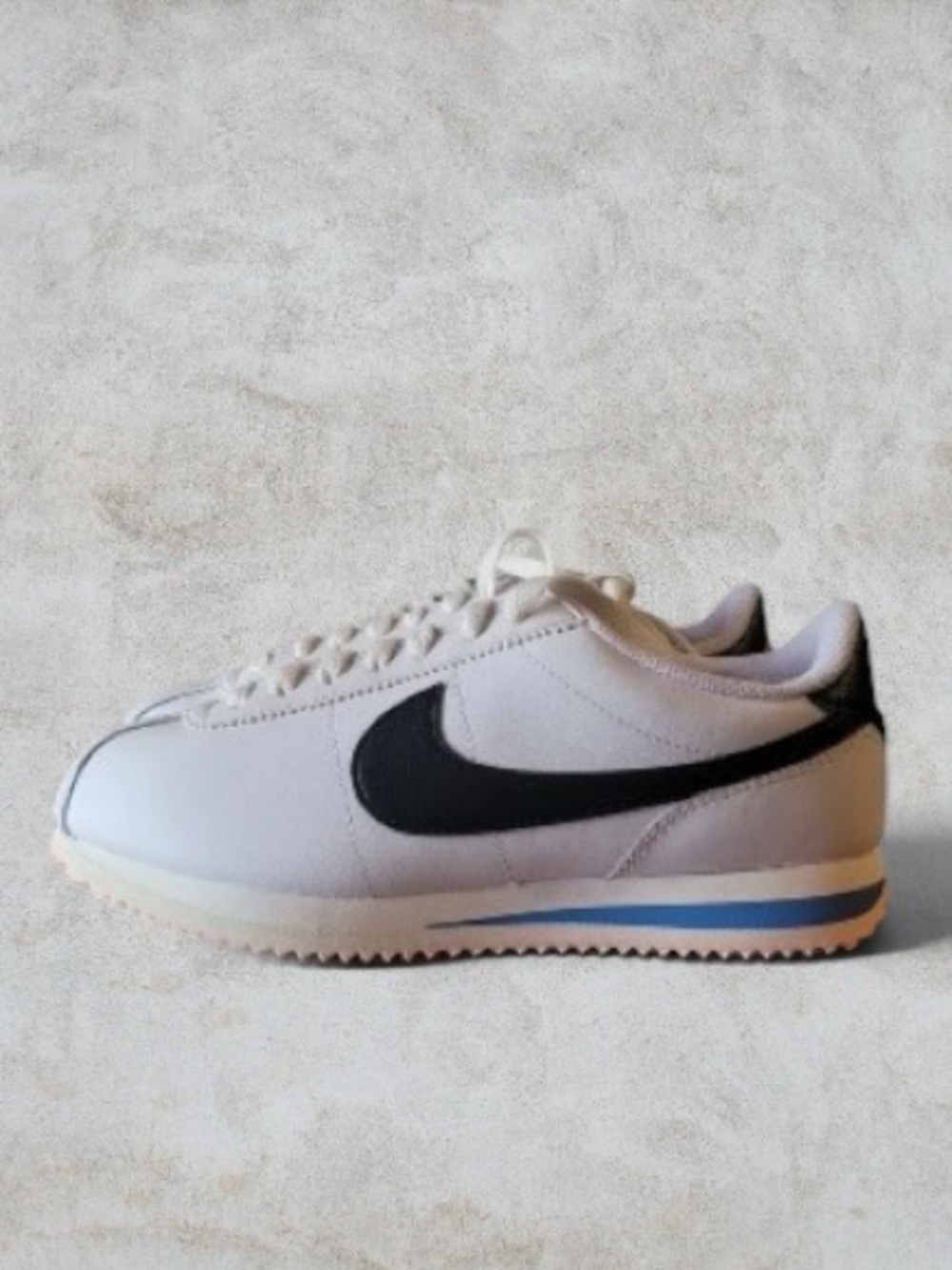 Nike Cortez Men's White Sneakers with Black Swoosh and Blue Accent